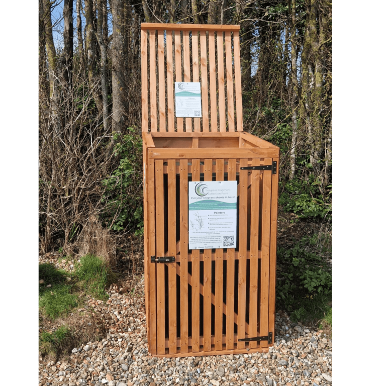 A Fragment collection point with its lid open. A sign on the collection point explains the initiative and what should be placed inside.
