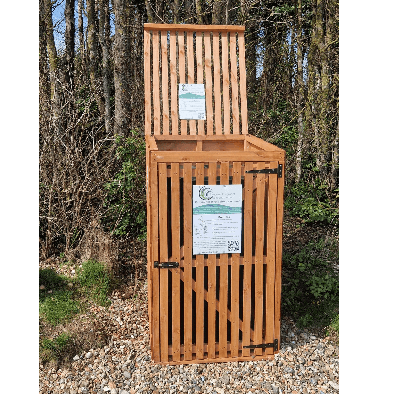 A Fragment collection point with its lid open. A sign on the collection point explains the initiative and what should be placed inside.