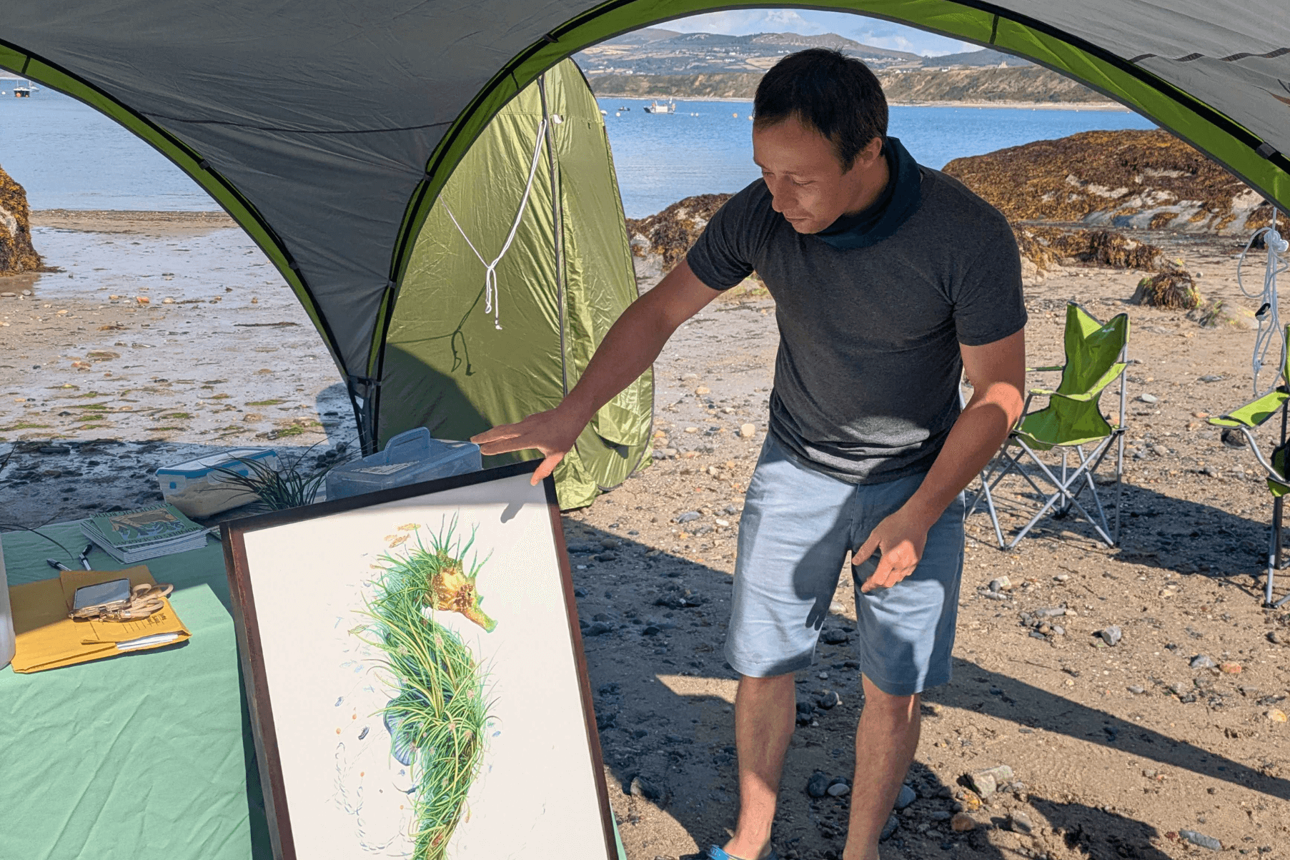Ocean Wildlife Artist Oli Leger introducing his artwork Ambassador to people on the beach