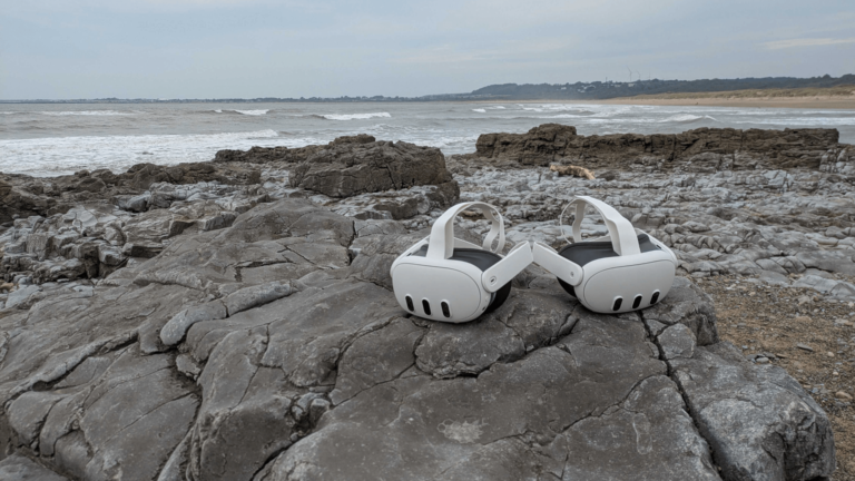 Two VR headsets are placed on the rocks at the coast at Ogmore in South Wales.