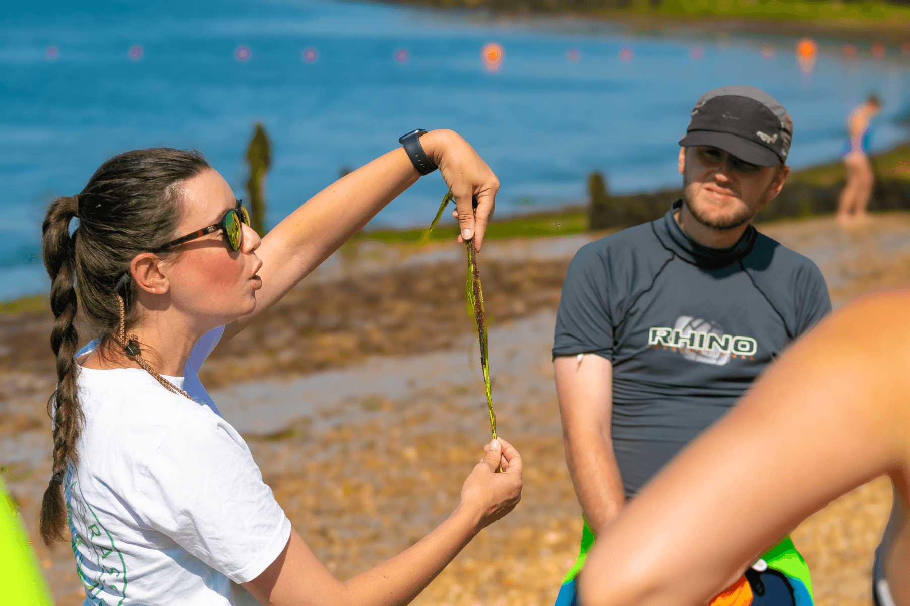Project Lead Anouska demonstates to volunteers how to collect seeds.