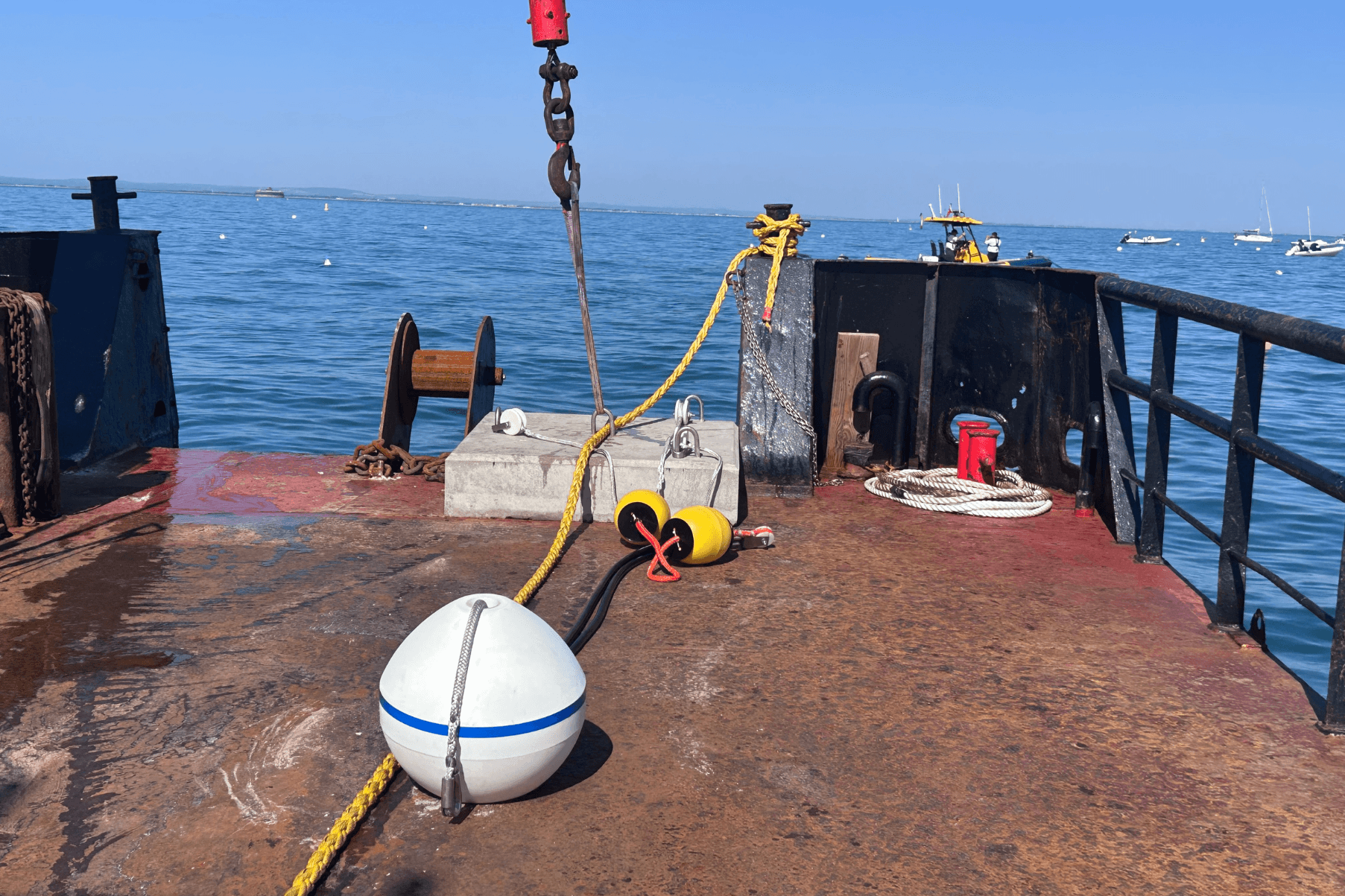 A clear day in the Isle of Wight. Boat can be seen in the distance. An Advanced Mooring System on a boat is prepared to be installed.